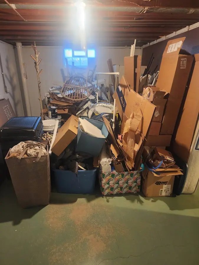 Roll-off dumpster container at job site for 6 Yard Dumpster Rental in Montcalm